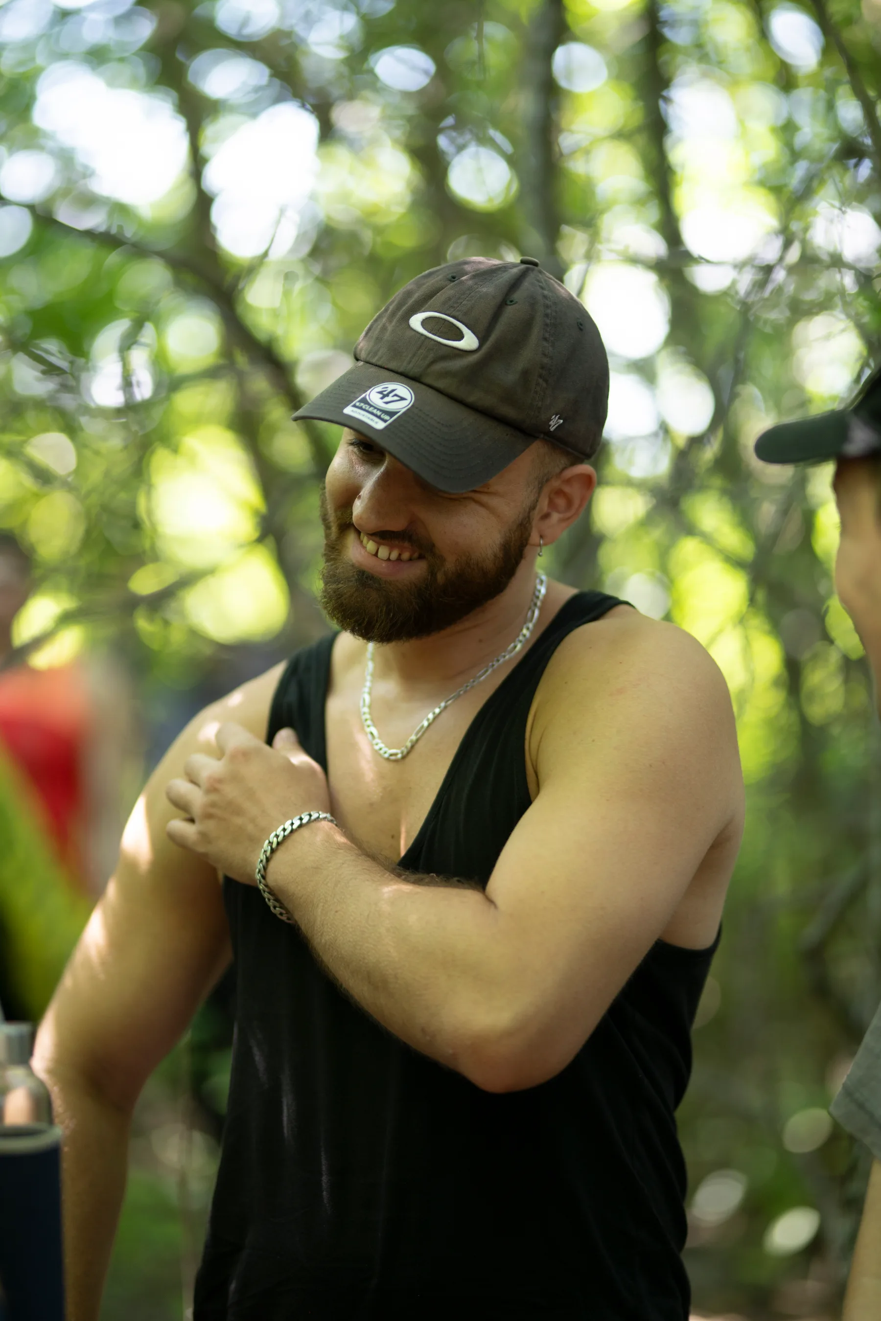 A smiling attendee at Less is Sound in a Vienna forest